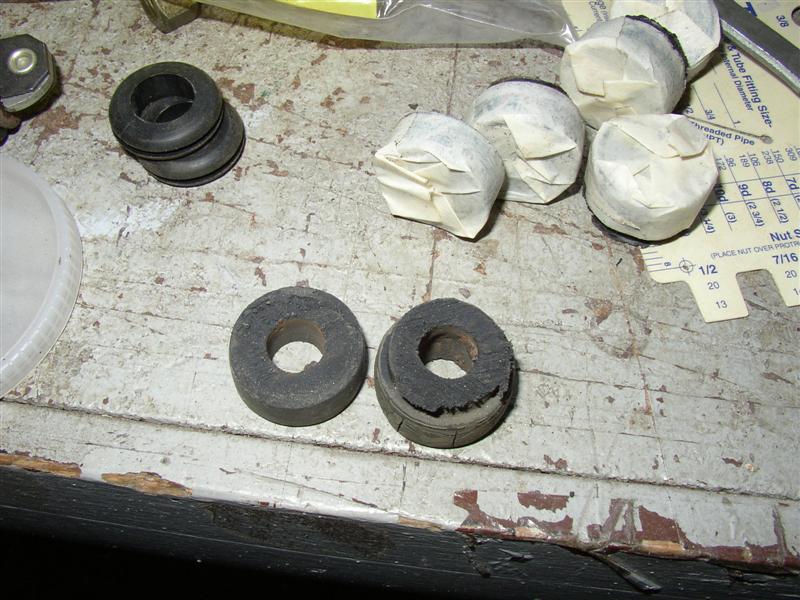 Old headlight base-fender grommets cut in half.