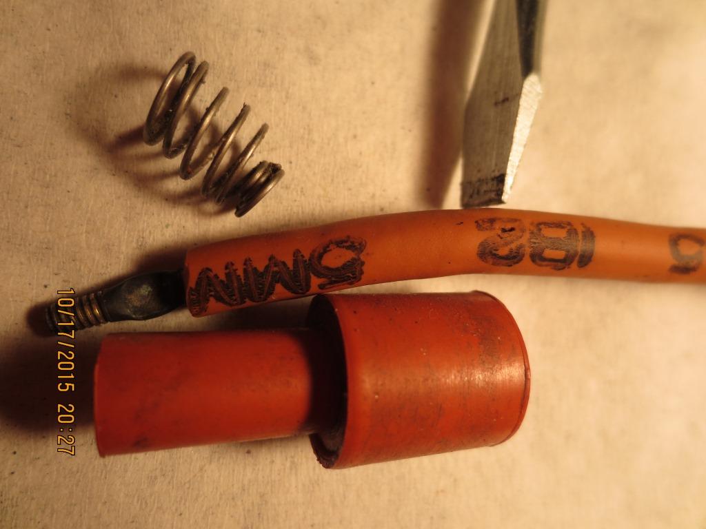 Failure is at the base of the 2 near the tip of the screwdriver.