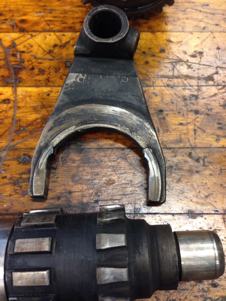 On the shaft you can see the wear on the short trapezoidal splines. This is where a fair amount of the backlash I was seeing came from. The fork had some pretty significant damage. Looks like it was preloaded into the clutch at some point and fried.