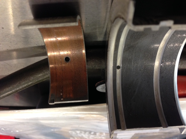 The thrust brg. is .010&quot;. The rod brg. is .020&quot; and was dated 11/77. I suspect it's been in there for a bit. The wear on the main is weird. It's very smooth &amp; consistent, and about the color of JB weld.
